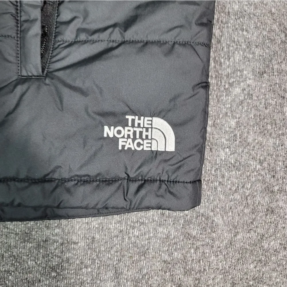 Premium insulated puffer vest by The North Face featuring embroidered Synchrony